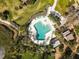Aerial view of a community pool with ample lounge seating at 1519 Pelican Point Dr # 292, Sarasota, FL 34231