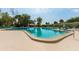 Large community pool with plenty of lounge chairs and tables at 1519 Pelican Point Dr # 292, Sarasota, FL 34231