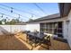 Outdoor patio area with dining table and string lights at 1953 Wheeling Ave, North Port, FL 34288