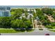 Aerial view of a landscaped community entrance leading to a beach with ocean access at 2155 Harbourside Dr # 804, Longboat Key, FL 34228