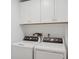 Laundry room with side-by-side washer and dryer at 2155 Harbourside Dr # 804, Longboat Key, FL 34228