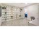 Office with built-in bookshelves and view to bathroom at 2155 Harbourside Dr # 804, Longboat Key, FL 34228