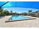 A community pool with a gazebo and patio furniture is covered with shade sails at 2155 Harbourside Dr # 804, Longboat Key, FL 34228