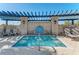 Community hot tub with pergola and surrounding lounge chairs at 2324 Springhaven Ln, Bradenton, FL 34211