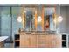 Modern bathroom featuring double sinks, custom cabinetry, and stylish mirrors provides elegance and functionality at 2410 Slough Rd, Sarasota, FL 34240