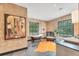 A bright bathroom features a soaking tub, cork walls, and a decorative rug at 2410 Slough Rd, Sarasota, FL 34240