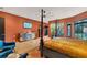 Spacious bedroom features a king bed, sitting area, and a view to a luscious back yard at 2410 Slough Rd, Sarasota, FL 34240