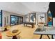 Spacious game room with a pool table, and unique artwork provides an entertaining atmosphere at 2410 Slough Rd, Sarasota, FL 34240
