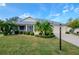 Single-story home with landscaped lawn at 2467 E Del Webb Blvd, Sun City Center, FL 33573