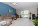 Spacious living room with pool view and comfortable seating at 2467 E Del Webb Blvd, Sun City Center, FL 33573
