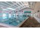 Indoor community lap pool with high ceilings at 2467 E Del Webb Blvd, Sun City Center, FL 33573