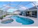 Relaxing pool and spa with covered patio at 2467 E Del Webb Blvd, Sun City Center, FL 33573