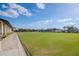 Expansive lawn bowling green with clubhouse at 2467 E Del Webb Blvd, Sun City Center, FL 33573
