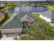 Aerial view of house, showcasing a large backyard and lake at 2603 River Woods Dr, Parrish, FL 34219