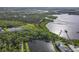 Panoramic aerial view of the property, showcasing the waterfront homes, community amenities and lush green surroundings at 2603 River Woods Dr, Parrish, FL 34219