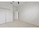 Spacious bedroom with a double closet and a doorway to another room at 2603 River Woods Dr, Parrish, FL 34219