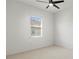 This bedroom features a window allowing natural light into the room and a ceiling fan for added comfort at 2603 River Woods Dr, Parrish, FL 34219