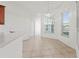Inviting dining space featuring stylish tile flooring, modern light fixture, and bright windows at 2603 River Woods Dr, Parrish, FL 34219