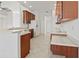 Modern kitchen with stainless steel appliances, breakfast bar, and ample cabinet space at 2603 River Woods Dr, Parrish, FL 34219