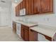 Kitchen featuring modern appliances, sleek countertops, and wood cabinetry at 2603 River Woods Dr, Parrish, FL 34219