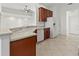 Open kitchen featuring modern appliances, updated countertops, and convenient layout at 2603 River Woods Dr, Parrish, FL 34219