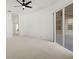 Open living room with plush carpeting and sliding glass doors to the outdoor patio at 2603 River Woods Dr, Parrish, FL 34219