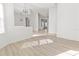 Inviting living area with sleek floors and large window, providing an abundance of natural light at 2603 River Woods Dr, Parrish, FL 34219
