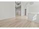 Spacious living room showcasing new floors transitioning to tile and open sightlines to other rooms at 2603 River Woods Dr, Parrish, FL 34219