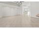 Expansive living area boasts sleek tile flooring and open layout perfect for entertaining at 2603 River Woods Dr, Parrish, FL 34219