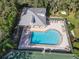 Community pool with a clubhouse and lounge chairs at 2603 River Woods Dr, Parrish, FL 34219