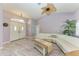 Spacious living room with light walls, a large sectional sofa, and wood-look floors at 316 Roseling Cir, Venice, FL 34293