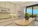Bright kitchen with ocean views and stainless steel appliances at 415 L Ambiance Dr # C703, Longboat Key, FL 34228