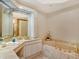 Elegant bathroom with a large soaking tub and updated fixtures at 415 L Ambiance Dr # C703, Longboat Key, FL 34228