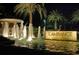 L'Ambiance entrance with a fountain and signage at night at 415 L Ambiance Dr # C703, Longboat Key, FL 34228