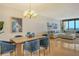 Elegant dining area with hardwood floors and ocean views at 415 L Ambiance Dr # C703, Longboat Key, FL 34228