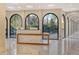 Elegant lobby with modern reception desk and arched windows at 415 L Ambiance Dr # C703, Longboat Key, FL 34228