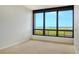 Spacious bedroom with large windows and ocean views at 415 L Ambiance Dr # C703, Longboat Key, FL 34228