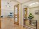 Bright and airy entryway with hardwood floors and large mirror at 415 L Ambiance Dr # C703, Longboat Key, FL 34228