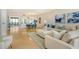 Open living space with hardwood floors and ocean view at 415 L Ambiance Dr # C703, Longboat Key, FL 34228