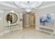 Stylish lobby with a large mirror and modern art at 415 L Ambiance Dr # C703, Longboat Key, FL 34228