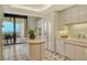 Well-equipped kitchen with tile floor and ocean view at 415 L Ambiance Dr # C703, Longboat Key, FL 34228