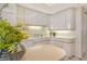 Modern kitchen with white cabinets and an island at 415 L Ambiance Dr # C703, Longboat Key, FL 34228