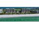 Aerial view of beachfront condo buildings and pristine beach at 415 L Ambiance Dr # C703, Longboat Key, FL 34228