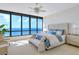 Bright bedroom with large windows offering ocean views at 415 L Ambiance Dr # C703, Longboat Key, FL 34228