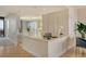 Modern kitchen with island and ocean view at 415 L Ambiance Dr # C703, Longboat Key, FL 34228