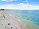 Aerial view of a beautiful beach with clear water and people enjoying the sun at 430 Monroe Dr, Sarasota, FL 34236