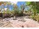 Spacious backyard with a patio and tropical landscaping at 430 Monroe Dr, Sarasota, FL 34236