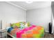 Bright bedroom with a king-size bed and colorful bedding at 4403 Pike Ave, Sarasota, FL 34233