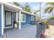 Front porch with gray deck and potted plants at 4403 Pike Ave, Sarasota, FL 34233