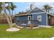 Charming one-story house with a gray exterior, deck, and fenced backyard at 4403 Pike Ave, Sarasota, FL 34233
